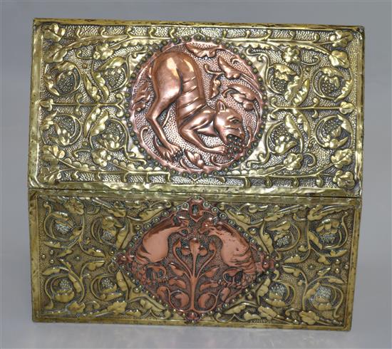 An Arts and Crafts embossed brass and copper casket, circa 1900, length 30cm, height 28cm